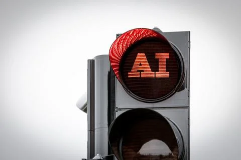 AI artificial intelligence concept. Red warning light is on at the traffic light Stock Photos