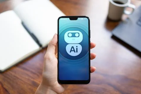 AI Artificial intelligence Deep machine learning concept. Robot icon on mobile Stock Photos