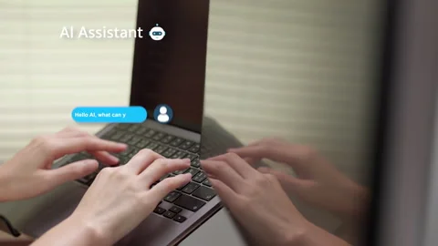AI assistant chat on laptop with hands typing. Stock Footage 316657078