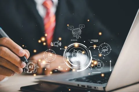 AI assists a businessman using a computer, demonstrating how ai can help bu.. 库存照片