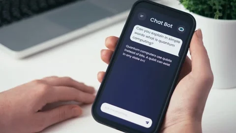 AI Chatbot Explains Quantum Computing on Smartphone - Futuristic Tech Stock Footage 332634194