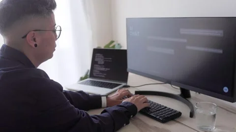 AI chatbot: Programmer using artificial intelligence for software development Video stock 242441337