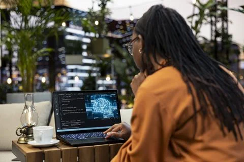 AI cloud computing code fills laptop screen in close-up Stock Photos