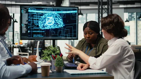 AI company software developers discussing tech roadmap Stock Footage 323144146