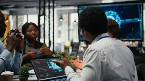 AI company system administrators discussing tech roadmap Stock Footage 323238511