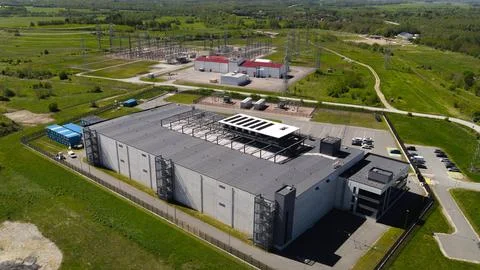 AI data center building connected to electrical substation Stock Photos