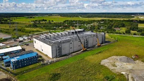 AI data center building construction with cranes working Stock Photos
