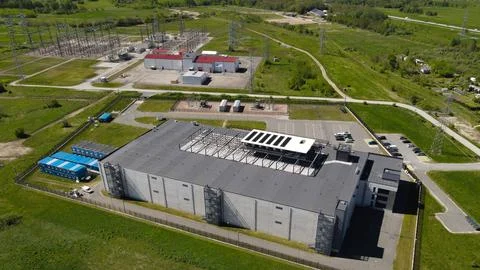 AI data center building integrating solar panels with electrical substation Stock Photos