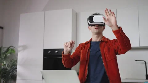 AI developer testing VR simulation in headset, fixing video game bugs Stock Footage 337907222