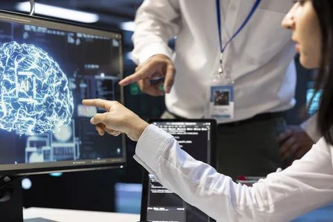 AI, display close up and teamwork with developers pointing at brain interface Фото