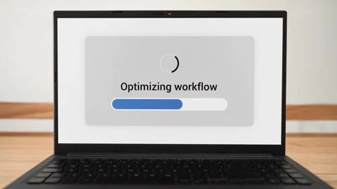 AI doing workflow optimization on a laptop with progress bar on the screen. Stock Footage 310296226