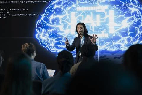AI-driven presentation in auditorium showing artificial intelligence tech Stock Photos