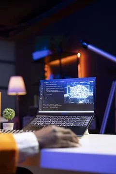 AI expert writes code on laptop in apartment office, close up Stockfoto's