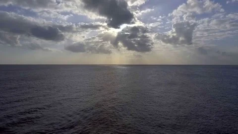 AI Flying Up High Ocean Clouds Sun Aerial Stock Footage 70482023