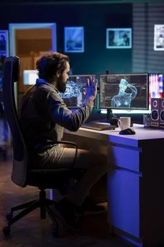 AI gaining humanoid form inside cyberspace, waving hand, saluting programmer Stock Photos