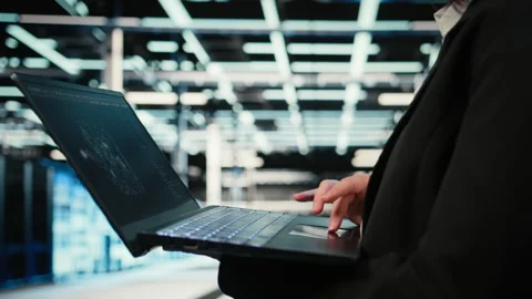 AI LLM assistant, laptop closeup and technician in data center Stock Footage 329325113