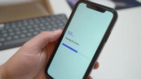 AI model training progress on smartphone screen completes with model trained Video stock 342603207