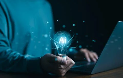 AI or Artificial intelligence concept. Man is holding a bright light bulb, Stock Photos