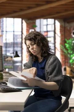 AI powered software generates a virtual spaceship station for a woman developer Stock Photos