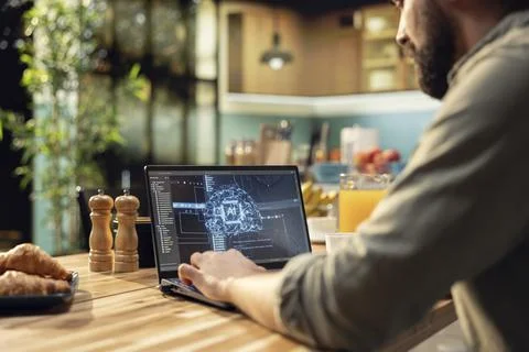 AI-powered software, remote worker with laptop, artificial intelligence Stock Photos