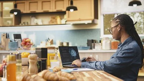 AI-powered software, remote worker with laptop, artificial intelligence Stock-Fotos