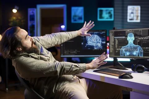 AI robot gaining humanoid form, scaring afraid engineer Stock Photos
