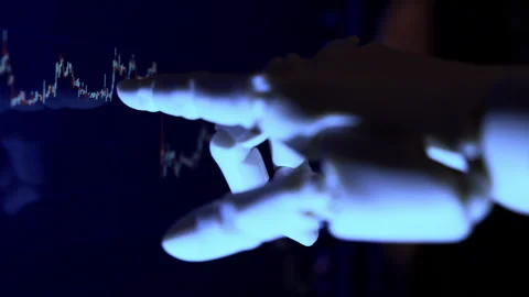 AI robot hand analyzing financial data from a computer screen. Stock Footage 337964004