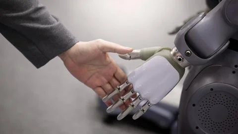 AI Robot shaking hands with man. Close up shaking hand with robotic arm Stock Photos
