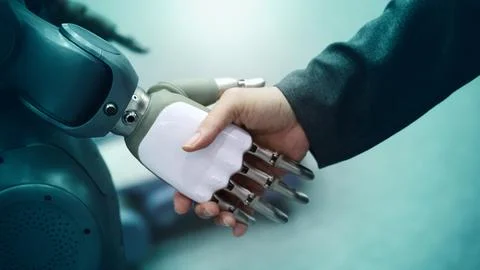 AI Robot shaking hands with man. Close up shaking hand with robotic arm Stock-Fotos