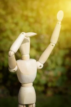 AI robotic doll is looking forward on sunlight and waiting for his drone Stock Photos