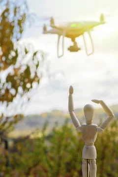 AI robotic doll is looking forward far away and parting his drone. toned Stock Photos