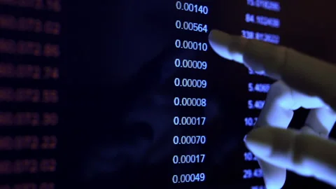 AI robotic hand managing digital assets and tracking cryptocurrency on screen Stock Footage 337897116