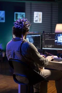 AI scientist uploading consciousness into computer, using EEG headset 写真素材