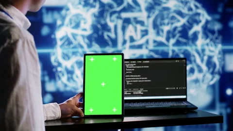 AI script coding on green screen tablet Stock Footage 251591655