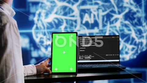 AI script coding on green screen tablet Stock Image #260654316