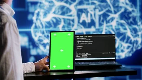 AI script coding on green screen tablet Foto stock