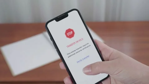 AI Security Alert Holding Digital Money Transfer for Verification Stock Footage 341400627