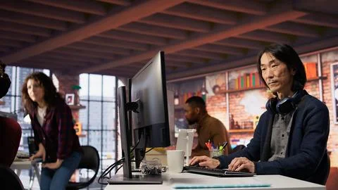 AI startup senior programmer overseeing deep learning applications Stock Photos