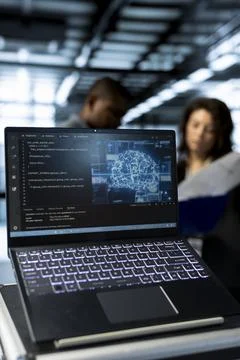 AI tech used on laptop by data center employees, close up Foto stock