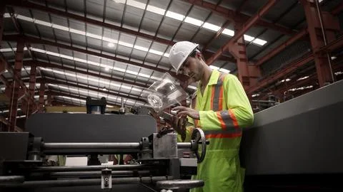 Ai using. Engineers and technicians use AI inspect industrial equipment. Stock Photos