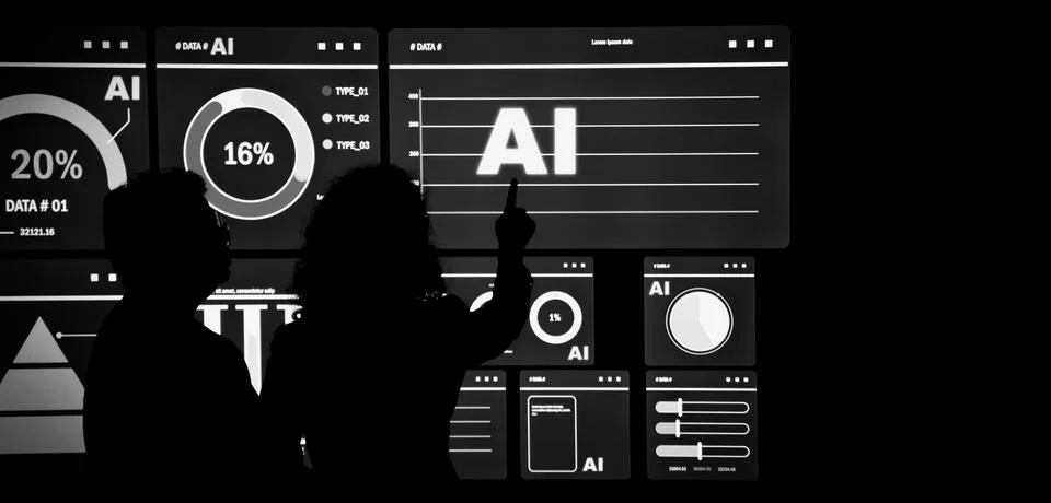 AI Using. Silhouetted analysts interact with a large AI data display. 스톡 사진
