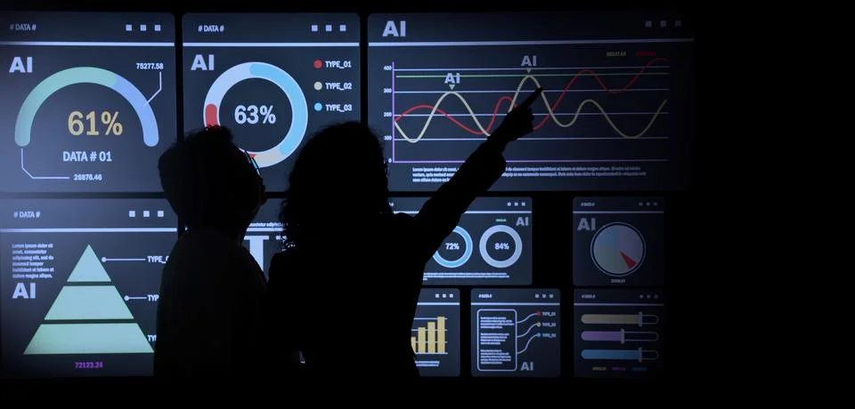 AI Using. Silhouetted analysts interact with a large AI data display. Stock Photos