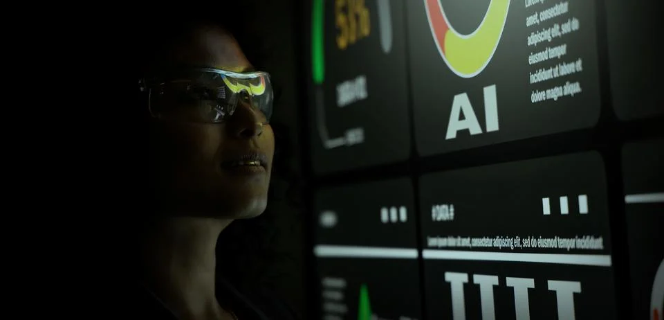 AI Using. Silhouetted analysts interact with a large AI data display. Stock Photos
