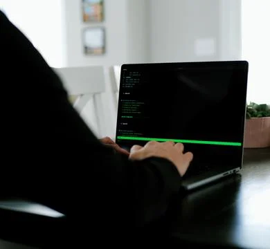 AI Vibe Coder Builds Billion Dollar Apps at Home Stock Photos
