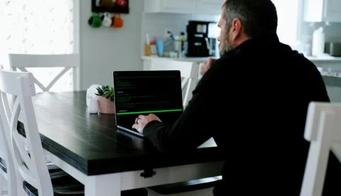 AI Vibe Coder Builds Billion Dollar Apps at Home Stock Photos