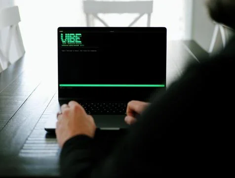 AI Vibe Coder Builds Billion Dollar Apps at Home Stock Photos