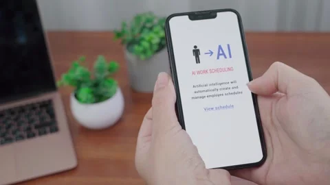 AI Work Scheduling Notification on Smartphone in Home Office Stock Footage 340998106