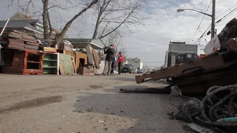Aid workers clean up neighborhood destroyed by hurricane Stock Footage