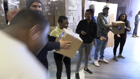Aid workers package emergency help for Cyclone Idai victims in Mozambique Stock Footage 105205644