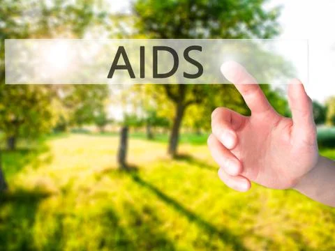 AIDS - Hand pressing a button on blurred background concept on visual screen. Stock-Fotos